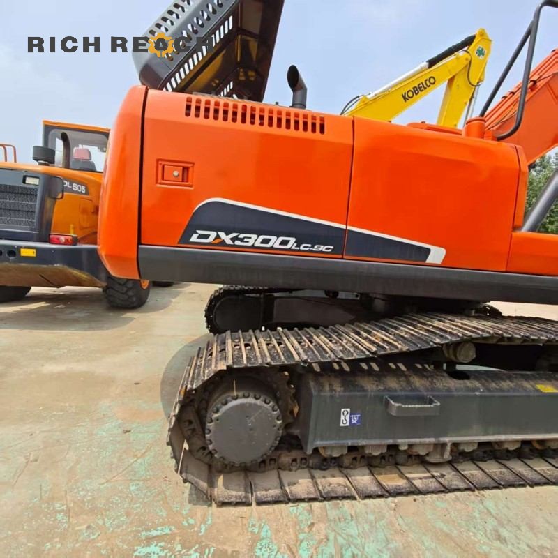 Side profile showing boom and arm of a 2023 Doosan DX300 excavator, includes video, $41,000 for sale